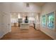 Open floor plan with bright kitchen and stainless appliances, hardwood floors and island with quartz countertops at 1342 Carter Rd, Decatur, GA 30030