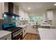 Bright kitchen featuring stainless steel sink, modern appliances and white cabinetry at 1342 Carter Rd, Decatur, GA 30030