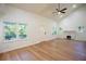 Bright living room features vaulted ceilings, fireplace, hardwood floors and large windows with views at 1342 Carter Rd, Decatur, GA 30030