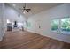 Open concept living area with hardwood floors, vaulted ceiling, ceiling fan, and connecting kitchen at 1342 Carter Rd, Decatur, GA 30030
