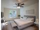 The main bedroom has hardwood floors, natural light, and tasteful modern decor at 1342 Carter Rd, Decatur, GA 30030