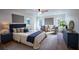 Comfortable main bedroom suite with rug, sitting area and natural light at 1342 Carter Rd, Decatur, GA 30030