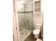 Updated bathroom featuring a glass shower and a toilet at 1820 Peachtree Nw St # 309, Atlanta, GA 30309