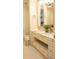 Bright bathroom featuring a vanity with dual sinks, marble countertops, and elegant fixtures at 1820 Peachtree Nw St # 309, Atlanta, GA 30309