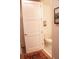 Powder room area with closed-door toilet on tile flooring at 1820 Peachtree Nw St # 309, Atlanta, GA 30309