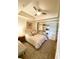 Bedroom featuring a queen-sized bed, rug, ceiling fan, and built-in closet shelving at 1820 Peachtree Nw St # 309, Atlanta, GA 30309