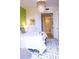 Sunlit bedroom boasting a decorative chandelier, complemented by a closet and bathroom at 1820 Peachtree Nw St # 309, Atlanta, GA 30309