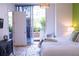 Bright bedroom with natural light, showcasing a view of the patio at 1820 Peachtree Nw St # 309, Atlanta, GA 30309