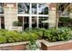 Beautifully landscaped outdoor area with lush greenery and patio access at 1820 Peachtree Nw St # 309, Atlanta, GA 30309