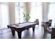 Bright game room with a pool table and comfortable seating at 1820 Peachtree Nw St # 309, Atlanta, GA 30309