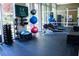 Well-equipped gym featuring exercise balls, free weights, rowing machine, and mirrored wall at 1820 Peachtree Nw St # 309, Atlanta, GA 30309