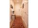 Hallway featuring hardwood floors, a rug, and a white front door at 1820 Peachtree Nw St # 309, Atlanta, GA 30309