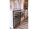 Close-up of a kitchen island featuring built-in wine storage, a microwave, and a stylish countertop with seating at 1820 Peachtree Nw St # 309, Atlanta, GA 30309
