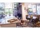 Bright living space with a kitchen island, a dining area, and access to a lush outdoor patio for seamless indoor-outdoor living at 1820 Peachtree Nw St # 309, Atlanta, GA 30309