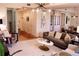 Bright living room featuring modern furnishings, a stylish light fixture, and an open layout flowing into the dining area at 1820 Peachtree Nw St # 309, Atlanta, GA 30309