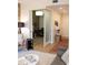 View from living space to an office area with a modern design, sleek desk, and stylish light fixture through a sliding door at 1820 Peachtree Nw St # 309, Atlanta, GA 30309