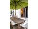 Outdoor patio area featuring a dining table and seating with an umbrella at 1820 Peachtree Nw St # 309, Atlanta, GA 30309