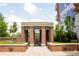Brick outdoor lounge area with architectural details and manicured landscaping at 1820 Peachtree Nw St # 309, Atlanta, GA 30309