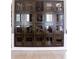Custom wine storage with glass-enclosed compartments for organized bottle display at 1820 Peachtree Nw St # 309, Atlanta, GA 30309