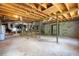 Unfinished basement with cement block walls and exposed beams, perfect for storage or future expansion at 2636 Flagstone Se Dr, Atlanta, GA 30316