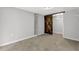 View of the finished basement showcasing exposed brick, barn door, and concrete floors at 2636 Flagstone Se Dr, Atlanta, GA 30316