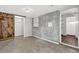 View of the finished basement showcasing exposed brick, barn door, and concrete floors at 2636 Flagstone Se Dr, Atlanta, GA 30316
