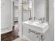Elegant bathroom features a double sink vanity, modern fixtures, and sleek shelving at 2636 Flagstone Se Dr, Atlanta, GA 30316