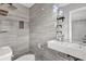 Modern bathroom with stylish gray tile, vessel sink, and unique lighting at 2636 Flagstone Se Dr, Atlanta, GA 30316