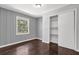 Comfortable bedroom with textured walls, a window view, and a sliding door closet at 2636 Flagstone Se Dr, Atlanta, GA 30316