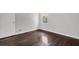 Cozy bedroom showcasing hardwood floors and natural light from the window at 2636 Flagstone Se Dr, Atlanta, GA 30316