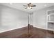 Bedroom with hardwood floors, ceiling fan, and attached bathroom at 2636 Flagstone Se Dr, Atlanta, GA 30316