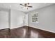 A bedroom with wood floors, a ceiling fan, and natural light at 2636 Flagstone Se Dr, Atlanta, GA 30316