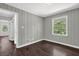 Inviting bedroom with classic walls, hardwood flooring, and ample natural light at 2636 Flagstone Se Dr, Atlanta, GA 30316