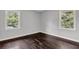Bedroom with two windows offering natural light and hardwood floors at 2636 Flagstone Se Dr, Atlanta, GA 30316