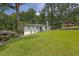 Well-kept single-story home with a lush front yard, and beautiful dark shingled roof at 2636 Flagstone Se Dr, Atlanta, GA 30316