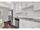 Bright kitchen featuring stainless steel appliances, dark hardwood floors, and granite countertops at 2636 Flagstone Se Dr, Atlanta, GA 30316