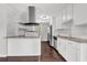 Bright kitchen featuring stainless steel appliances, dark hardwood floors, granite countertops, and subway tile at 2636 Flagstone Se Dr, Atlanta, GA 30316