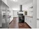 Bright kitchen featuring stainless steel appliances, dark hardwood floors, and granite countertops at 2636 Flagstone Se Dr, Atlanta, GA 30316