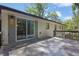 Concrete patio with sliding glass door and wood railing at 2636 Flagstone Se Dr, Atlanta, GA 30316