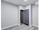 Partially finished basement with stylish gray flooring, ample storage, and neutral color palette at 3860 Overlake Dr, Cumming, GA 30041