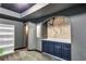 Finished basement area featuring a built-in cabinet with a Jurassic Park theme at 3860 Overlake Dr, Cumming, GA 30041
