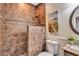 Tiled bathroom featuring a granite vanity, decorative mirror, and an enclosed tile shower stall for a spa-like experience at 3860 Overlake Dr, Cumming, GA 30041
