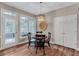 A cozy dining area, complete with wood floors and a decorative light fixture at 3860 Overlake Dr, Cumming, GA 30041