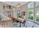 The eat-in dining area features wood floors and natural light from multiple windows at 3860 Overlake Dr, Cumming, GA 30041