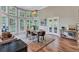 Bright dining area featuring large windows with natural light and wood floors at 3860 Overlake Dr, Cumming, GA 30041