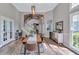 Elegant dining room with a view of the staircase and entryway, perfect for entertaining guests at 3860 Overlake Dr, Cumming, GA 30041