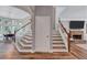 Inviting foyer with beautiful hardwood floors, staircase, and natural light at 3860 Overlake Dr, Cumming, GA 30041