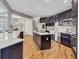 Well-appointed kitchen with a large island, stainless steel appliances, and stylish fixtures at 3860 Overlake Dr, Cumming, GA 30041
