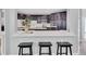 Stylish kitchen with breakfast bar, stainless steel appliances, and custom cabinetry at 3860 Overlake Dr, Cumming, GA 30041