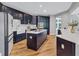 Beautiful kitchen features a central island, modern appliances, and dark cabinetry at 3860 Overlake Dr, Cumming, GA 30041